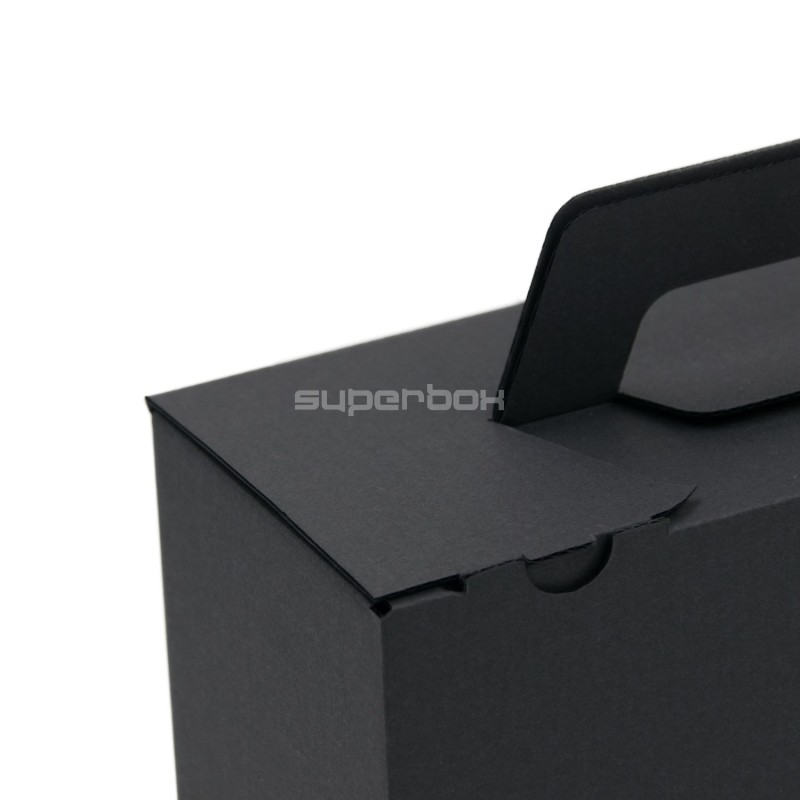 Schwarze kleine Koffer-ähnliche Geschenkbox mit Griff